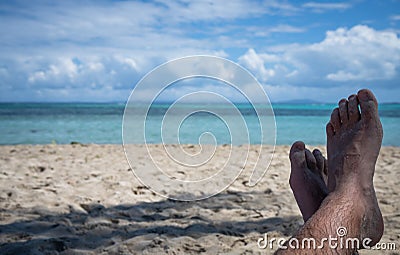 Crossed Feet in Paradise Stock Photo