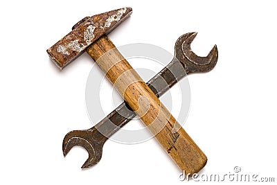 Crossed old hammer and wrench Stock Photo