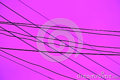 Crossed Wires over a dark lavender background Stock Photo