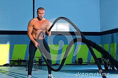 Crossfit battling ropes at gym workout exercise Stock Photo