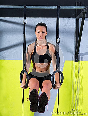 Crossfit dip ring woman workout at gym dipping Stock Photo
