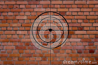 Crosshairs in front of a stone wall Stock Photo