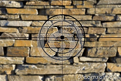 Crosshairs in front of a stone wall Stock Photo