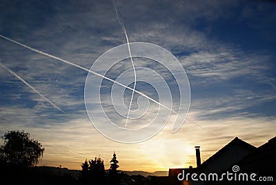 Crossing condensation trails Stock Photo