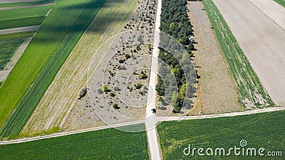 Crossroad of dirt roads view from the drone. Stock Photo