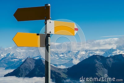 Crossroad signpost in blank concept available, confusion or decisions, in swiss alps Stock Photo