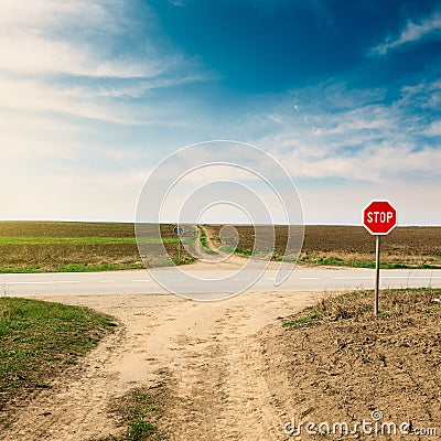 Crossroad with warning sign for priority road Stock Photo