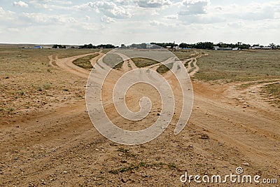 Crossroads of rural roads in a field Stock Photo