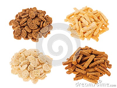 Croutons collection - wheat, rye sliced bread in heaps isolated on white background. Stock Photo