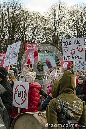 Crowd of activists at Animal Advocacy event with signs and banners in hands protest against animal abuse Editorial Stock Photo