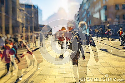 Crowd of anonymous people walking on busy city street Stock Photo