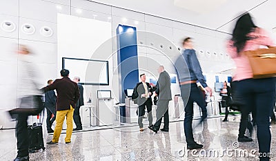 Crowd of business people at a trade show booth Stock Photo