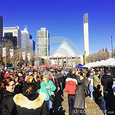 A crowd is busy at Churchill Square in front of city hall in downtown Edmonton, Alberta, Canada. Editorial Stock Photo