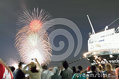 Crowd enjoying Japanese summer fireworks festival Editorial Stock Photo