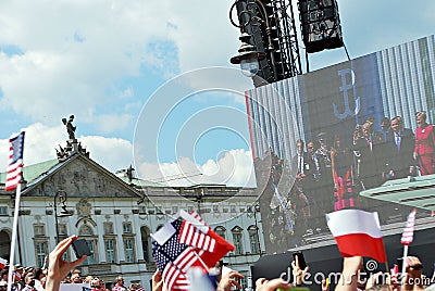 Crowd enthusiastically wave flags Editorial Stock Photo