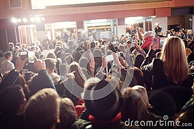 Crowd and fans at red carpet film premiere Editorial Stock Photo