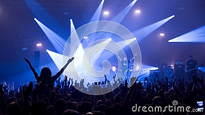 Crowd in front of the stage at the rock`n`roll gig Editorial Stock Photo