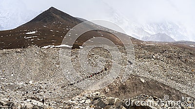 Crowd of hikers walking towards Everest base camp, Nepal Stock Photo
