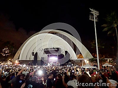 Crowd holds Cellphones in the air as Kapena plays on stage Editorial Stock Photo