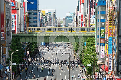 Crowd of Japanese people and the tourist walking and shopping with car traffic at Akihabara district Tokyo Japan Editorial Stock Photo