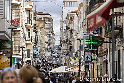 crowd of many tourists and shoppers Editorial Stock Photo