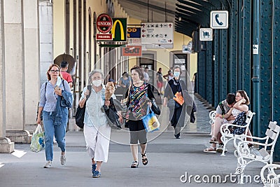 Crowd of Old women walking in the train station of Ljubljana, some wearing a facemask, during coronavirus covid 19 crisis Editorial Stock Photo