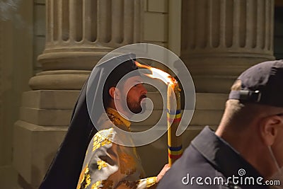 Crowd of people coming to receive holy light. Bucharest Patriarchal Cathedral Editorial Stock Photo