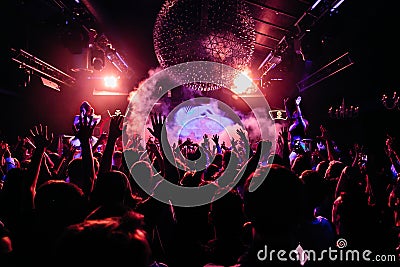 Crowd of people dancing at night club Editorial Stock Photo