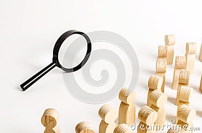 A crowd of people looking into a magnifying glass. Search and tracing concept, find out the truth. Find a solution to the problem Stock Photo