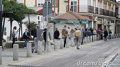Crowd of people queuing outside bank on restricted opening day Editorial Stock Photo