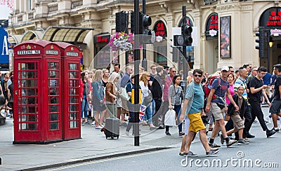 Crowd of people in the Regent street. Tourists, shoppers and business people rush time Editorial Stock Photo