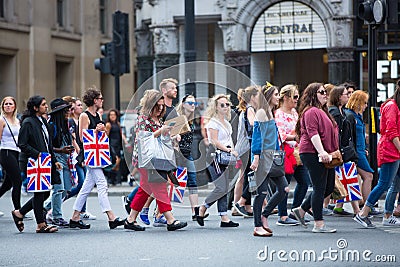 Crowd of people in the Regent street. Tourists, shoppers and business people rush time Editorial Stock Photo