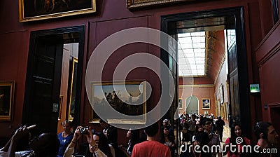 Crowd of people visiting Lourve Editorial Stock Photo