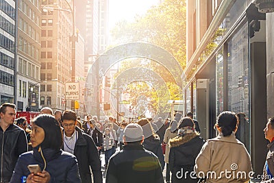 Crowd of people walking along Fifth Avenue at the intersection of West 42nd Street in Manhattan, New York City Editorial Stock Photo