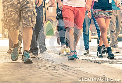 Crowd of people walking on the street - Detail of legs and shoes Stock Photo