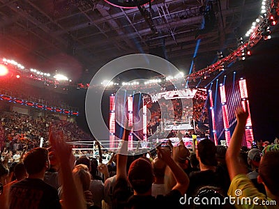 Crowd points fingers in the air with the Lucha Dragons during live taping of WWE Monday Night Raw Editorial Stock Photo