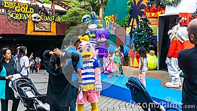 The crowd scene of animal mascots entertain the children on the stage at Sunway Lagoon theme park Editorial Stock Photo