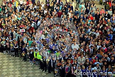 A crowd of schoolchildren and their parents at a formal meeting before the start of the school year at Lyceum 51 in Togliatti. Editorial Stock Photo
