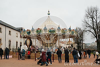 Crowd strolling near the carousel. La Roche Sur Yon, France Editorial Stock Photo