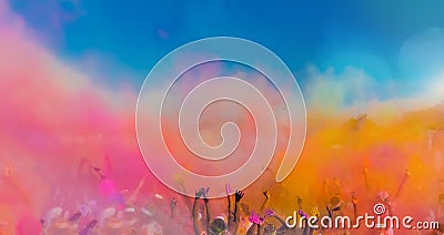 Crowd throwing bright coloured powder paint in the air Stock Photo