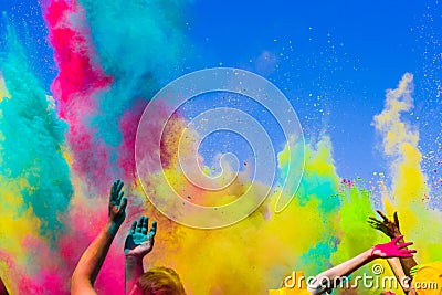 Crowd throws colored powder at holi festival Stock Photo