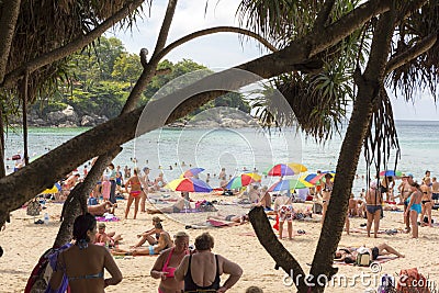 Crowd tourists, sunbed and umbrellas on the beach Editorial Stock Photo