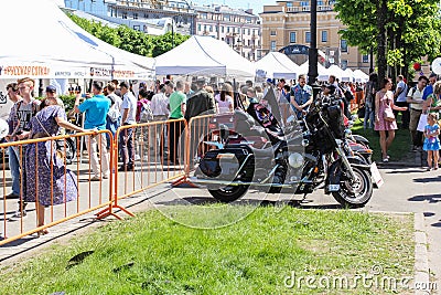 A crowd of visitors at a motor show. Editorial Stock Photo