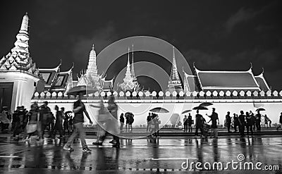 Crowd walking around grand palace in black and white Editorial Stock Photo