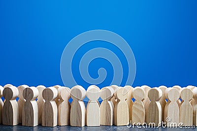 A crowd of wooden figures of people. Customers and buyers, statistics, preferences of Population. group of citizens, rally, Stock Photo