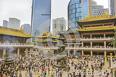 A crowd of worshipers in Buddhist temple Jing`an in Shanghai Editorial Stock Photo