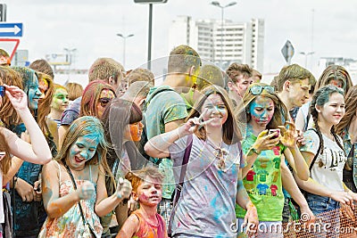 A crowd of young men with painted faces on the colorfest Editorial Stock Photo