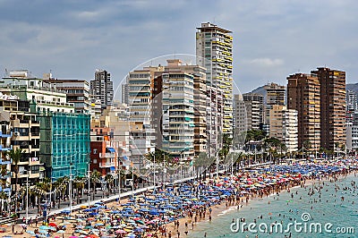 Crowded beach of Benidorm on a cloudy day Editorial Stock Photo