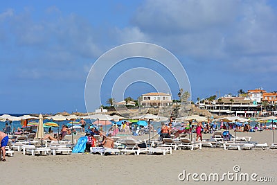 Crowded beach scene, summer holiday vibes Editorial Stock Photo
