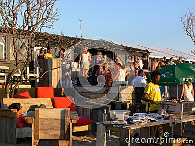 Crowded busy bar restaurant on beach scheveningen sun summer people terrace Editorial Stock Photo